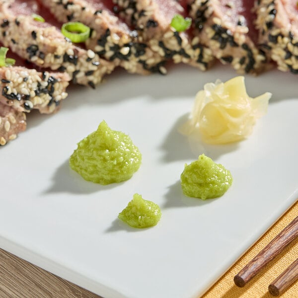 A plate of tuna with S&B Wasabi Paste on the side.