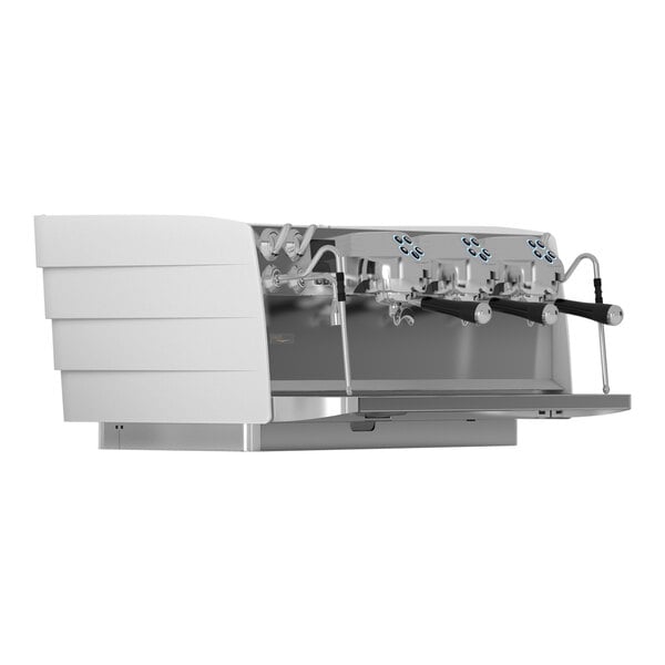 A close-up of a white Victoria Arduino Eagle Tempo espresso machine with three taps.