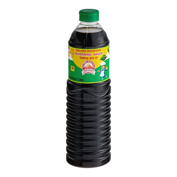 A black bottle of Golden Mountain seasoning sauce with a green cap.