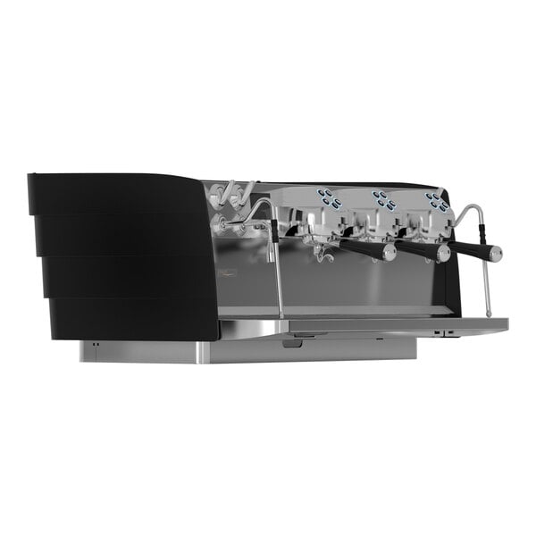 A matte black and silver Victoria Arduino espresso machine with three spouts.