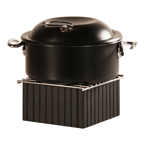 A black Cal-Mil chafer alternative on a black stand.