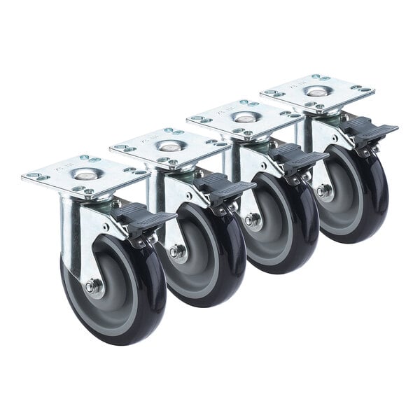 A set of four Krowne plate casters with black rubber wheels and front brakes.