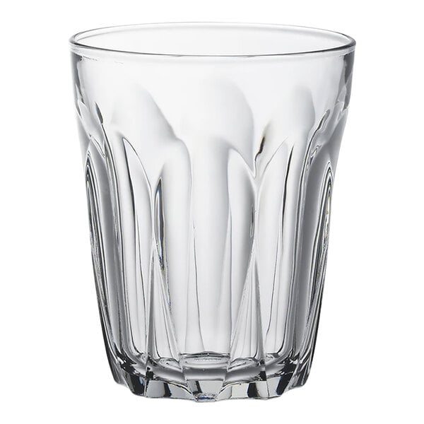 A clear Duralex glass tumbler with a wavy design.