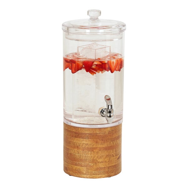 A Cal-Mil plastic beverage dispenser with strawberries and ice in it.