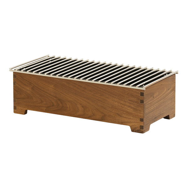 A wooden box with a metal grate inside.