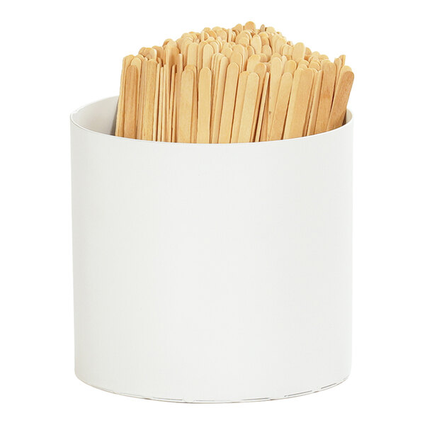A white container with wooden toothpicks.