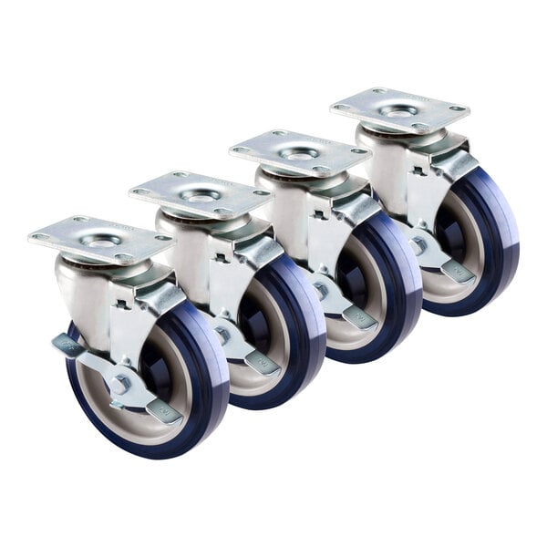 A group of Krowne plate casters with blue wheels and black wheels on white plates.