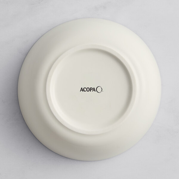 A gray Acopa Cape porcelain bowl with black text that reads "oma" in white.