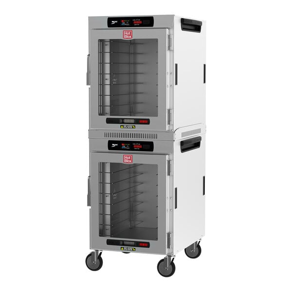 A white Metro heated holding cabinet with stacked clear doors.