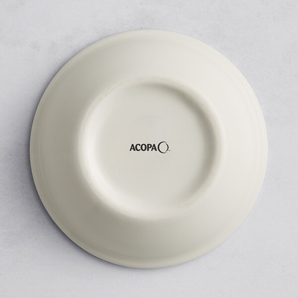 A round gray porcelain ramekin with the Acopa logo on the bottom.
