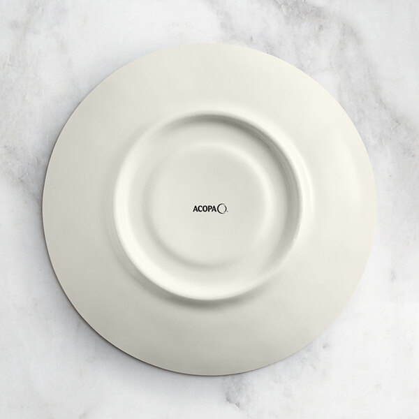 An Acopa Cape gray porcelain saucer with the word Oma in black text.