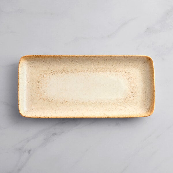A beige rectangular Acopa Cape porcelain platter.