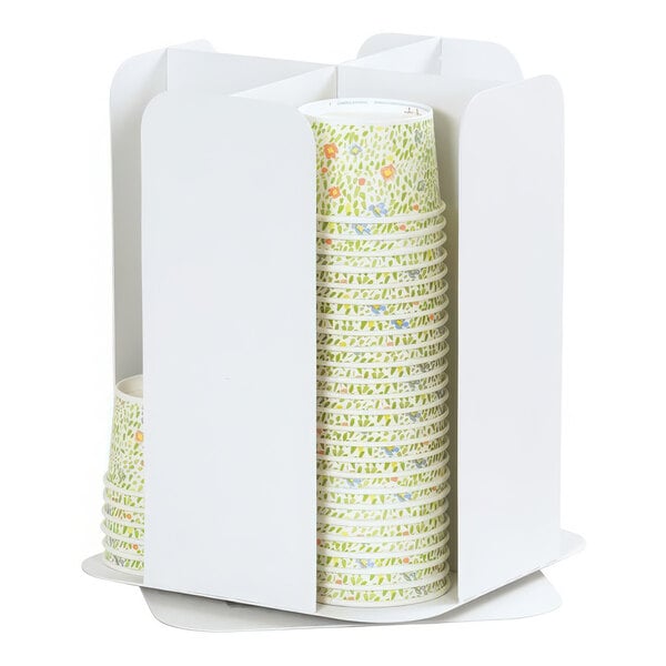 A stack of paper cups in a white metal Juno cup holder.