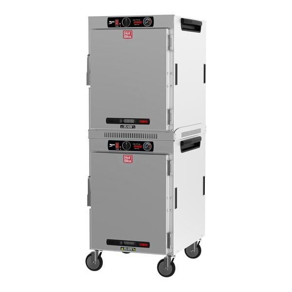 A white and gray Metro HotBlox dual cavity holding cabinet with wheels.