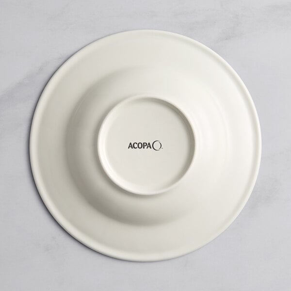 A white porcelain bowl with a black circle in the middle and black text that says "Acopa Architect"