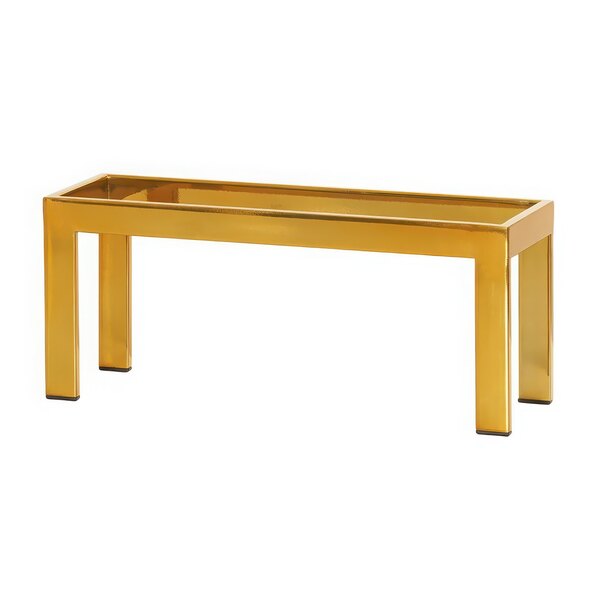 A gold rectangular brass metal display riser with legs.