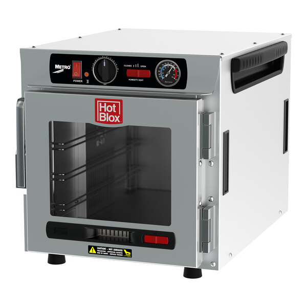 A white Metro countertop heated holding cabinet with a clear door.