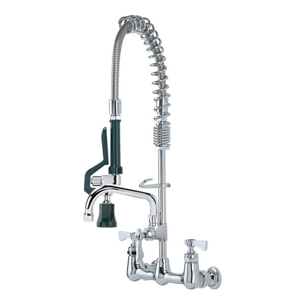 A chrome Krowne Royal Series wall-mount pre-rinse faucet with green handle and hose sprayer.