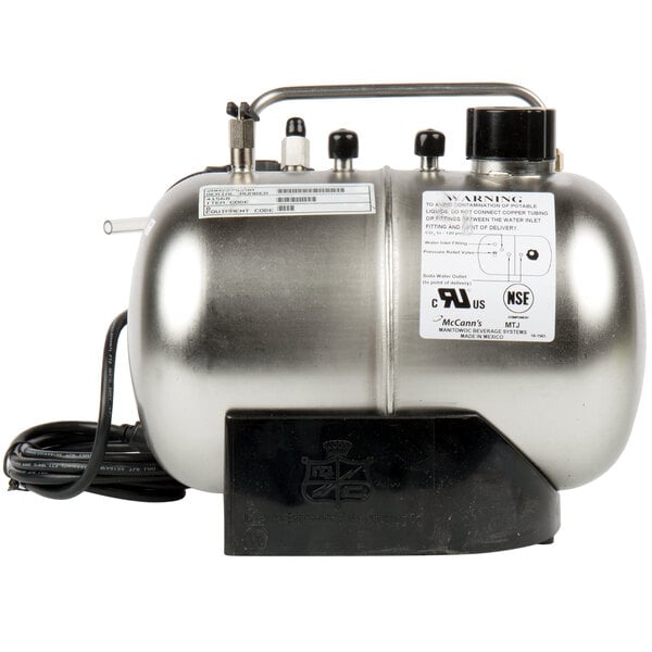 A silver McCann's carbonator tank with black and white labels.