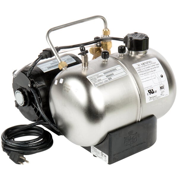 A McCann's Big Mac Fastflow carbonator with a hose attached.