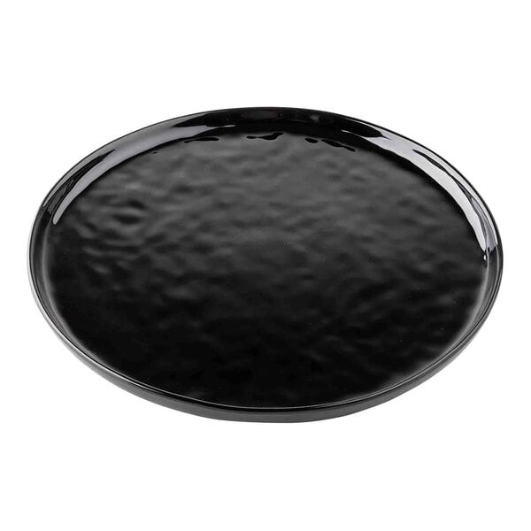 A Tablecraft black melamine plate with a textured surface and a ripple pattern.