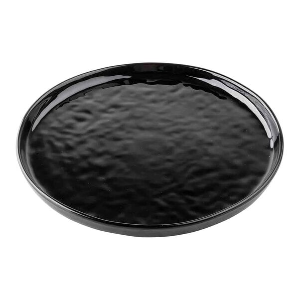 A Tablecraft black melamine plate with a textured ripple pattern.