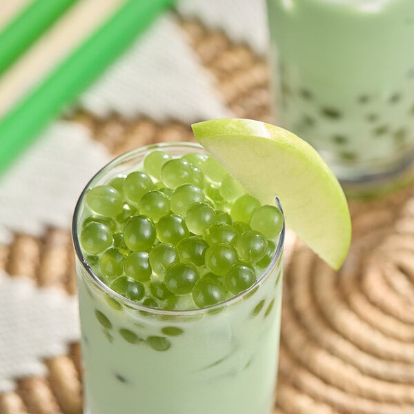 A close up of green apple flavored Bossen Pure25 Bursting Boba.