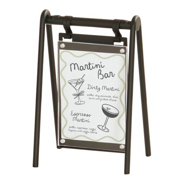 A black powder-coated metal frame holding a white sign with a black drawing of a martini glass.