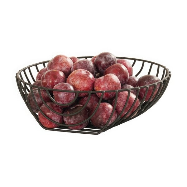 A black wire Madison fruit bowl with plums in it.