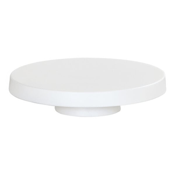 A white round Cal-Mil cake pedestal.