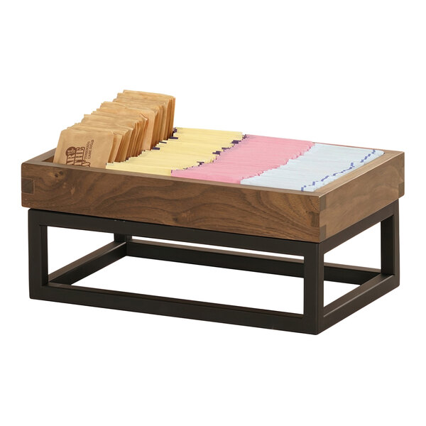 A wooden box on a table in a bakery display.