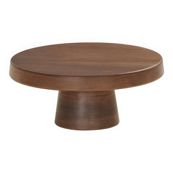 A round walnut melamine cake pedestal on a round wooden table.