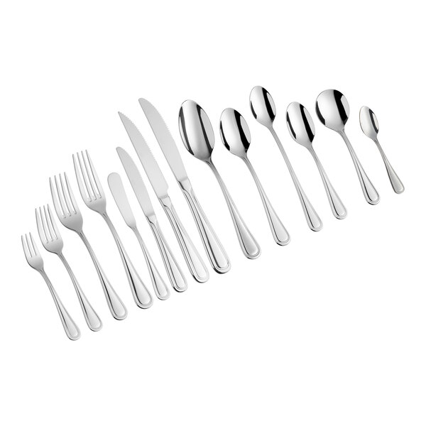 A group of Acopa stainless steel European table forks.