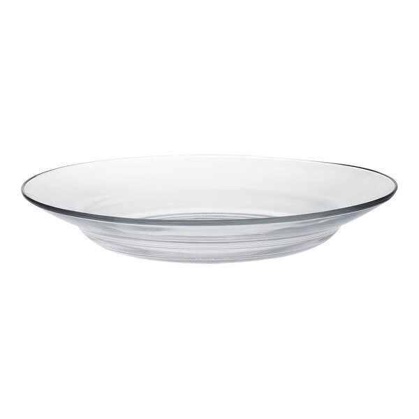 A close up of a clear glass Duralex soup plate with a rim.