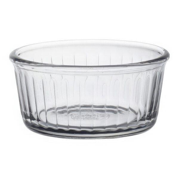 A clear glass Duralex ramekin with a rim.