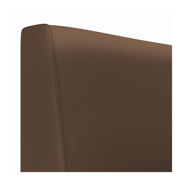 The brown leather back of a Cascade cafe booth.