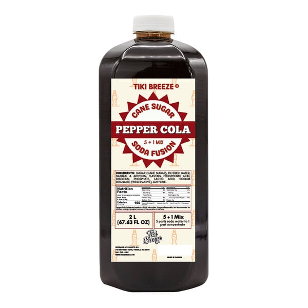 A bottle of Tiki Breeze Pepper Cola Energy concentrate with a white cap and a close-up of the label.