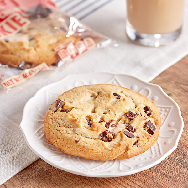 An Otis Spunkmeyer frozen chocolate chunk cookie on a plate.
