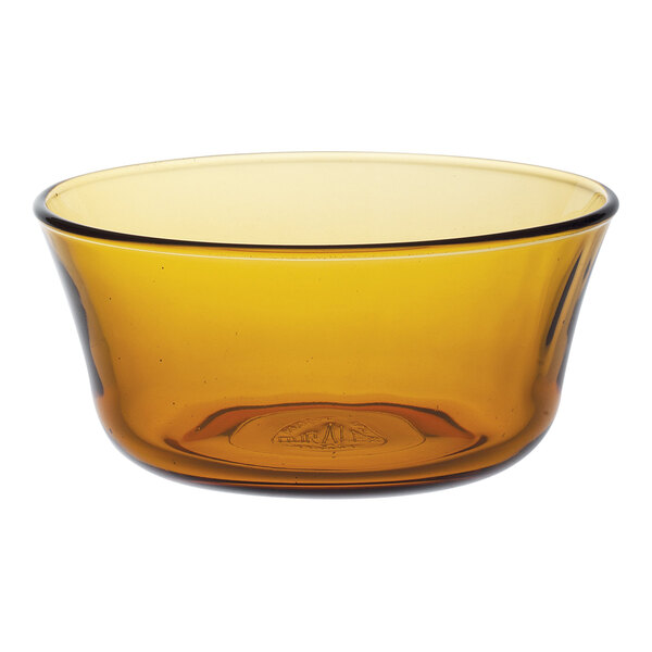 A close up of an amber Duralex Lys glass bowl with a rim.