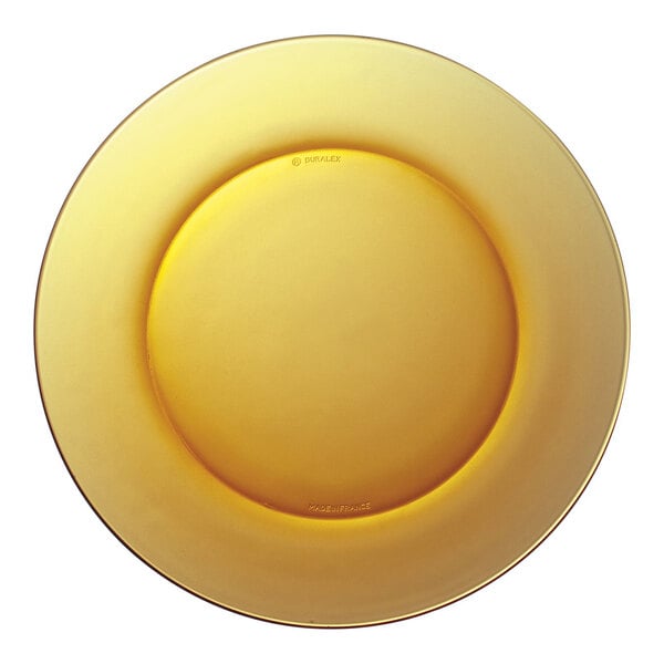 A close-up of a yellow Duralex Lys glass dessert plate.