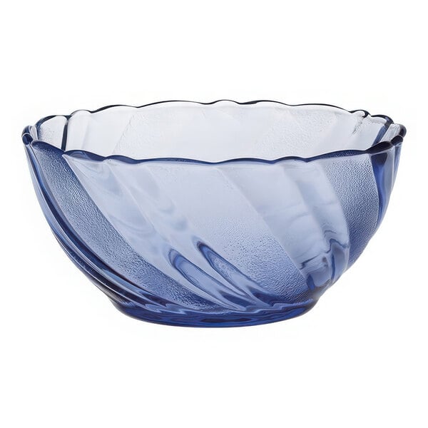 A blue Duralex glass bowl with a wavy design.