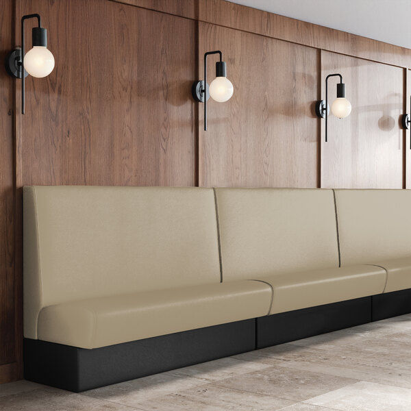 A 42-inch high, 30-inch long single back booth with fawn-colored upholstery and a black base, placed against a wood-paneled wall.