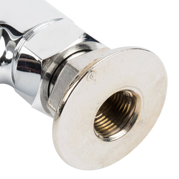 A chrome plated T&S deck mounted pantry faucet with metal nuts and a metal pipe.