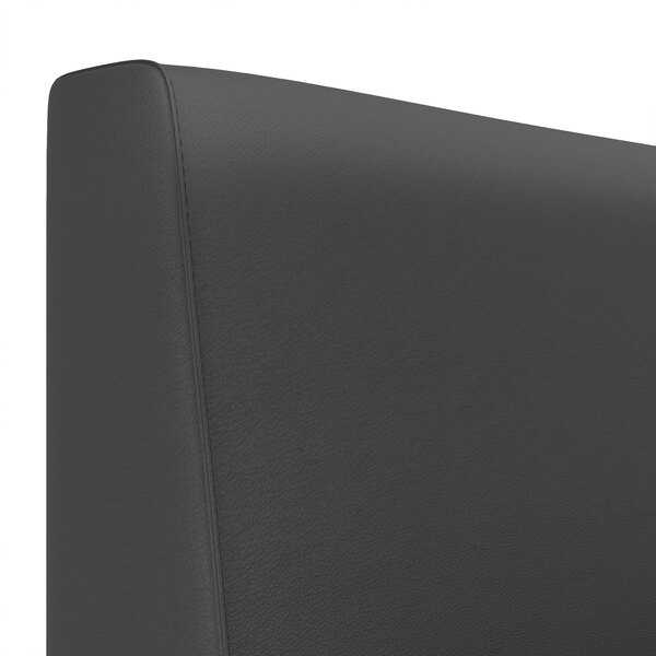 A close up of a black leather headboard on a QA Group Cascade 1/2 Circle Booth.