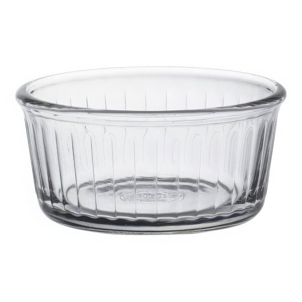 A clear glass Duralex ramekin with a rim.
