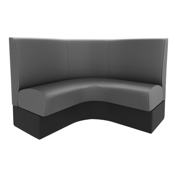A QA Group curved corner booth with black and grey upholstery.