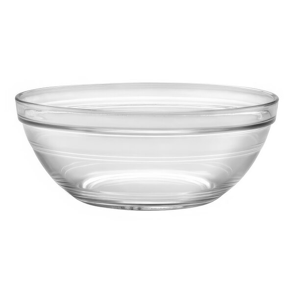 A clear glass bowl with a thin rim on a white surface.