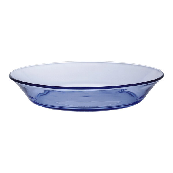 A clear glass bowl with a blue rim.
