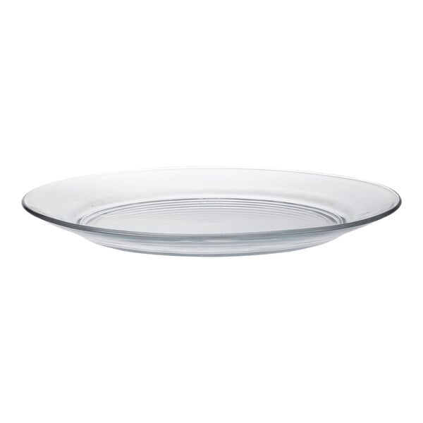 A clear glass dinner plate with a rim.