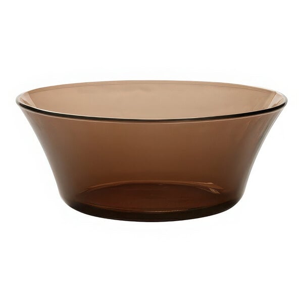 A brown Duralex glass bowl on a white background.